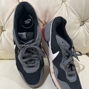 Cobra Kai set shoes. Nike Venture Runner.